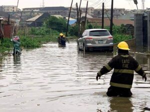 Residents being recused from a sinking story building in Lagos State
